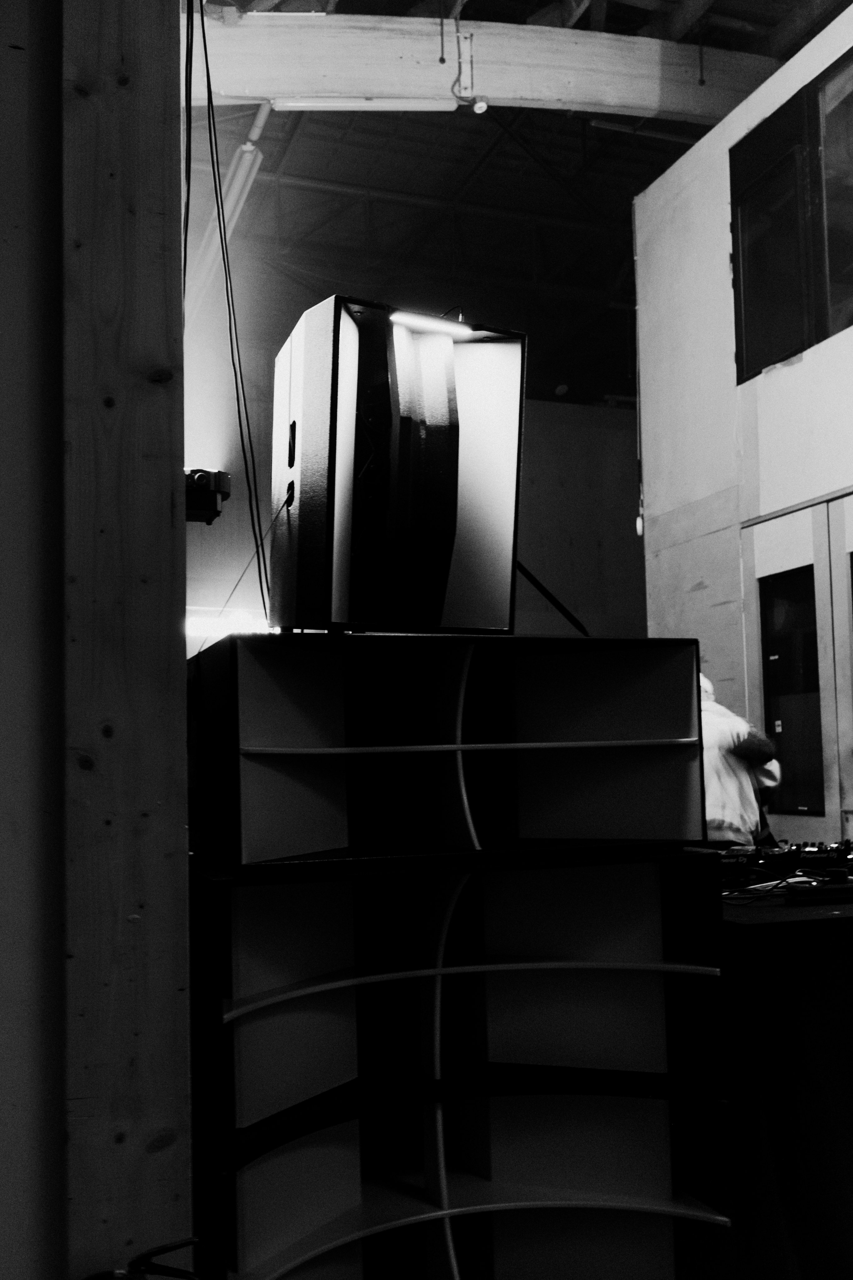 Black and white photo of the venue speaker stack